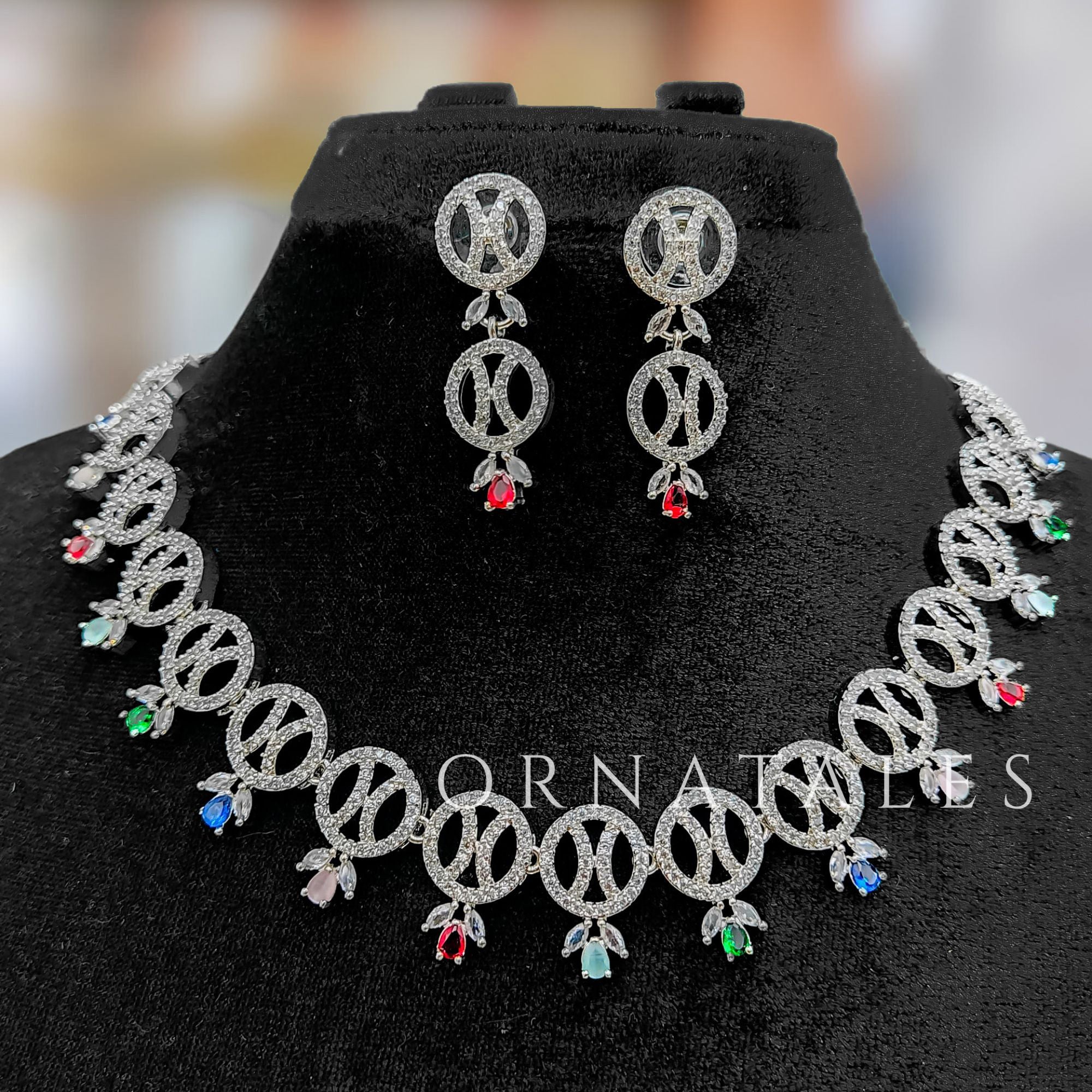 Multicolor Diamond Cut Necklace Set with interlinked round loops and droplet stones – festive jewellery with matching earrings – Ornatales