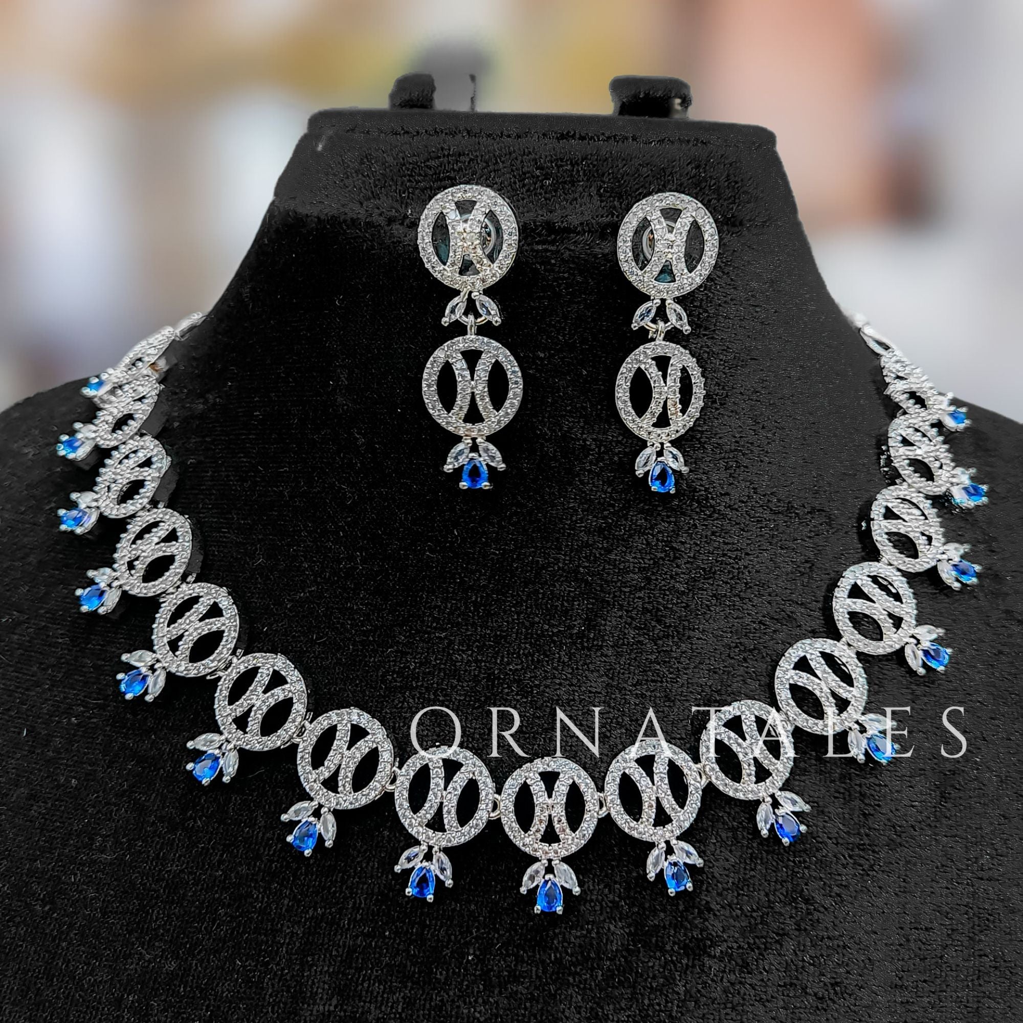 Royal Blue Diamond Cut Necklace Set with interlinked round loops, droplet stones, and matching earrings – elegant festive jewellery – Ornatales