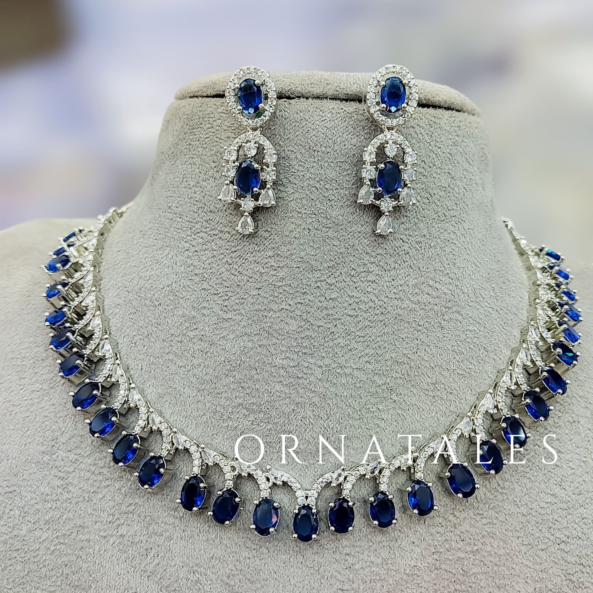 Royal Blue Diamond Cut Necklace Set with linear alternated oval and round stones – matching earrings – Ornatales