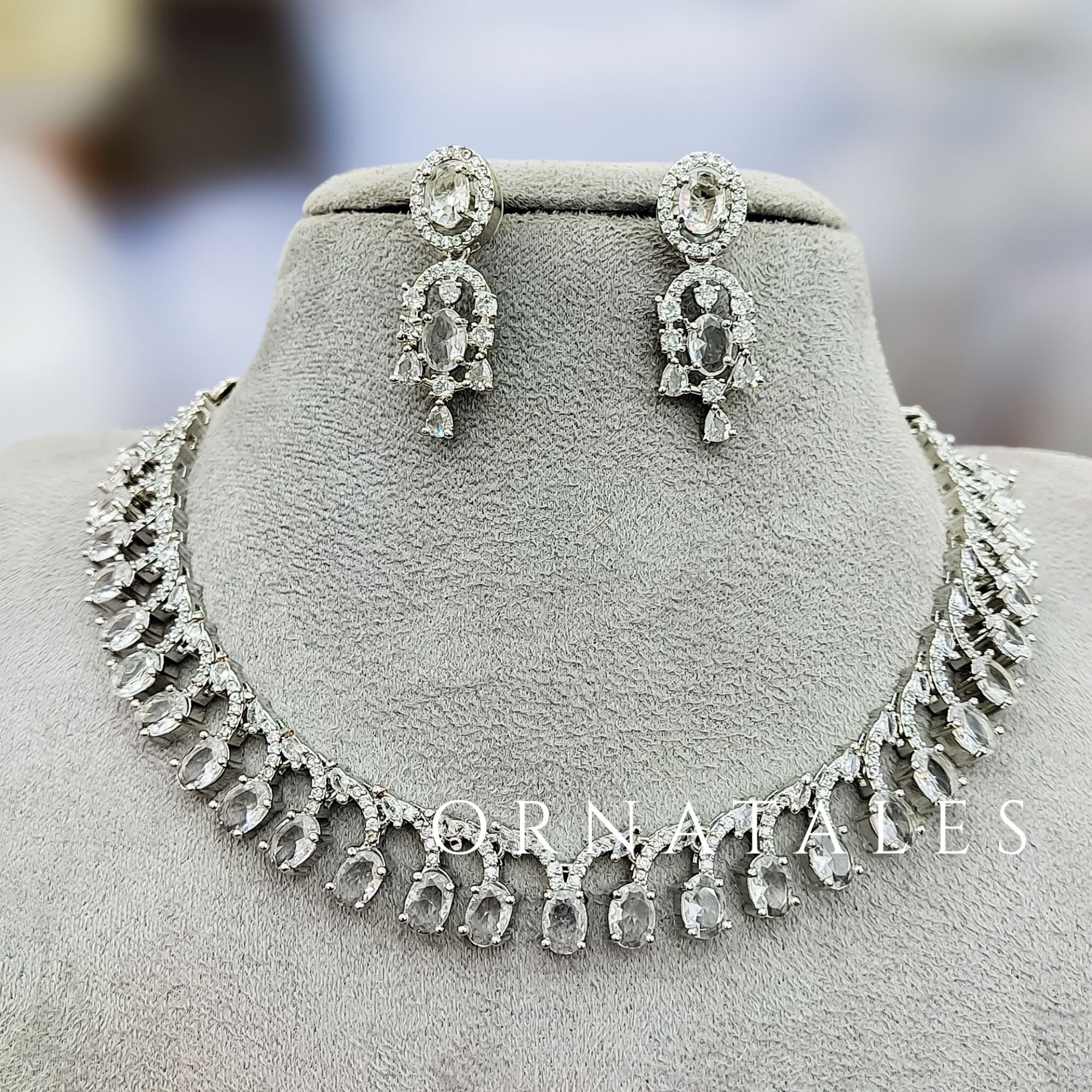 Crystal White Diamond Cut Necklace Set with linear alternated oval and round stones – matching earrings – Ornatales