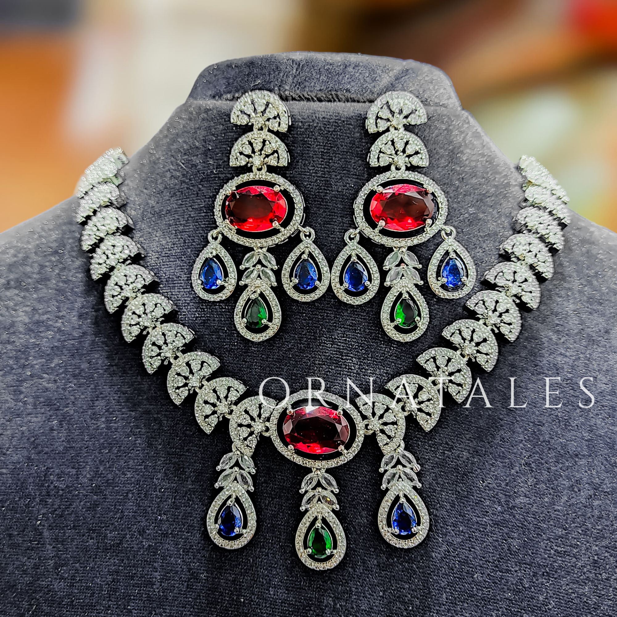 Multicolor Diamond Cut Necklace Set featuring Regal Drop Symphony design with ruby red, emerald green, and royal blue stones – Perfect for Bridal Look – Ornatales