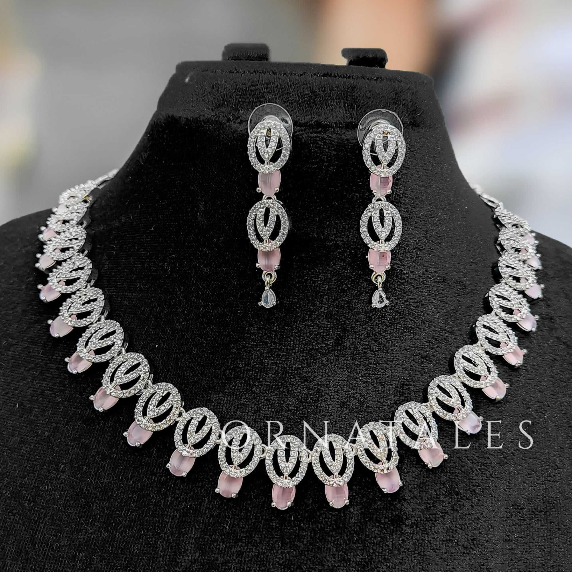 Pink Diamond Cut Necklace Set featuring spiral motifs with teardrop stones – Ornatales