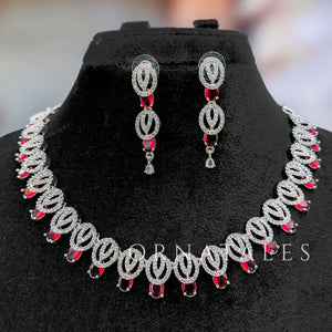 Ruby Red Diamond Cut Necklace Set featuring spiral motifs with teardrop stones – Ornatales