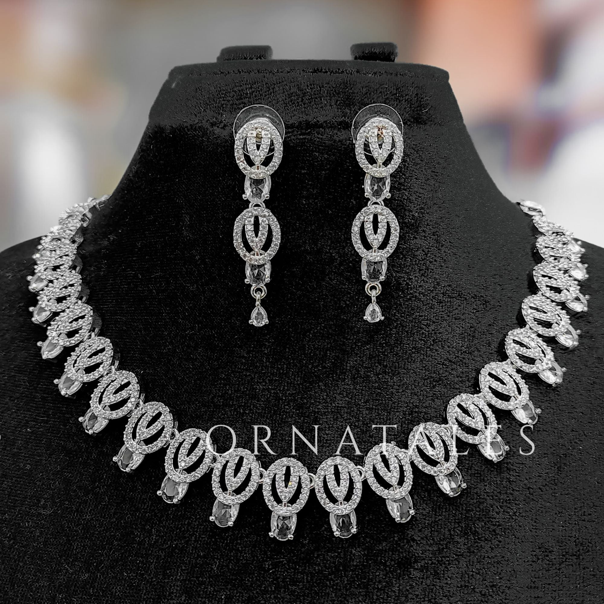 Crystal White Diamond Cut Necklace Set featuring spiral motifs with teardrop stones – Ornatales