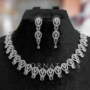 Crystal White Diamond Cut Necklace Set featuring spiral motifs with teardrop stones – Ornatales