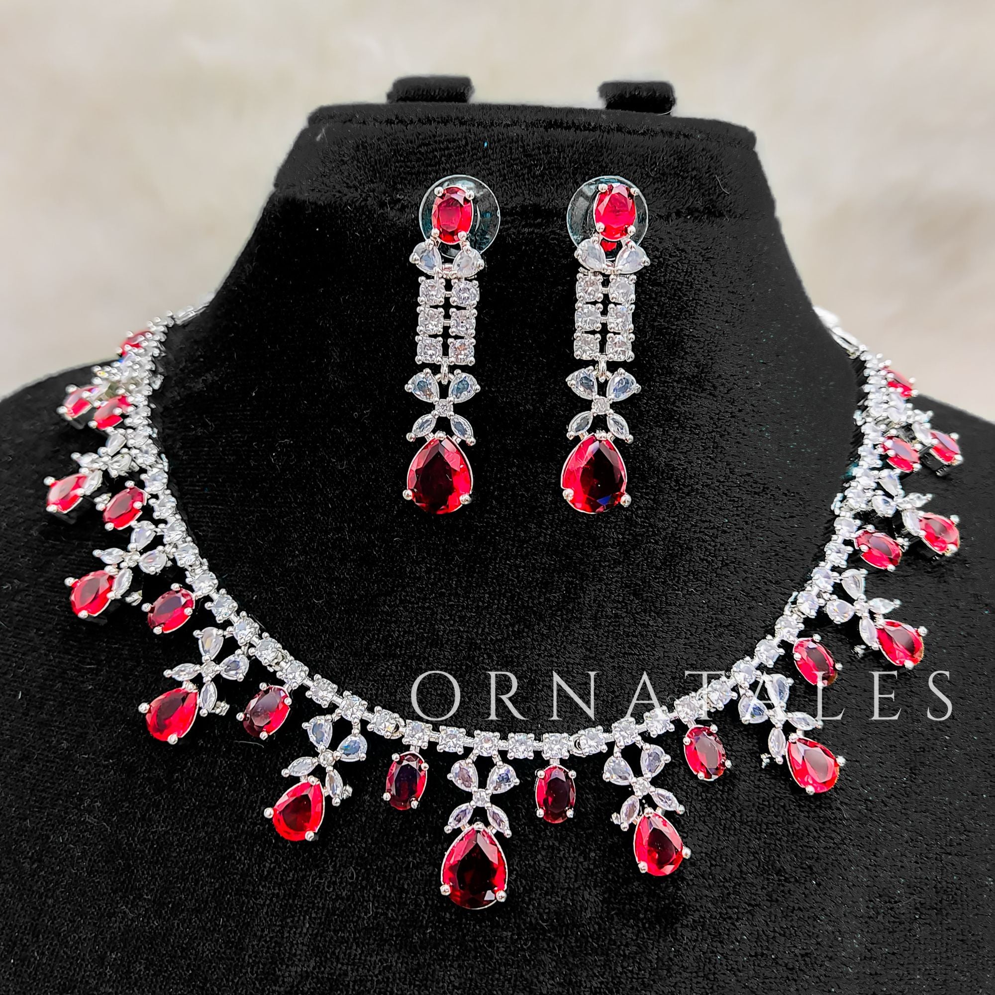 Ruby Red Diamond Cut Necklace Set featuring cascading teardrop stones and clustered diamond detailing – Ornatales