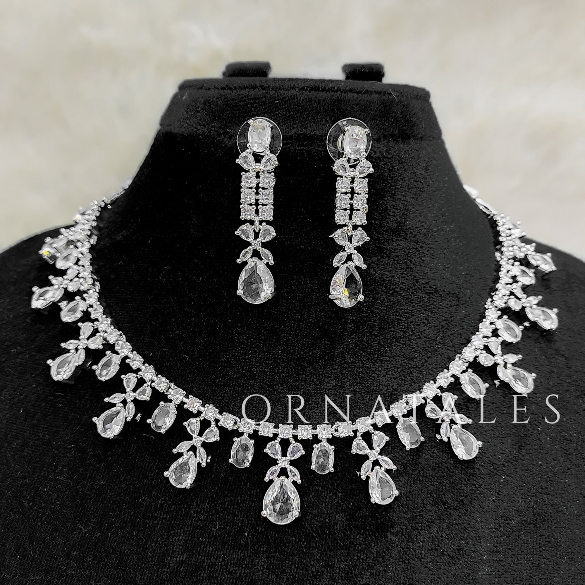 Crystal White Diamond Cut Necklace Set featuring cascading teardrop stones and clustered diamond detailing – Ornatales
