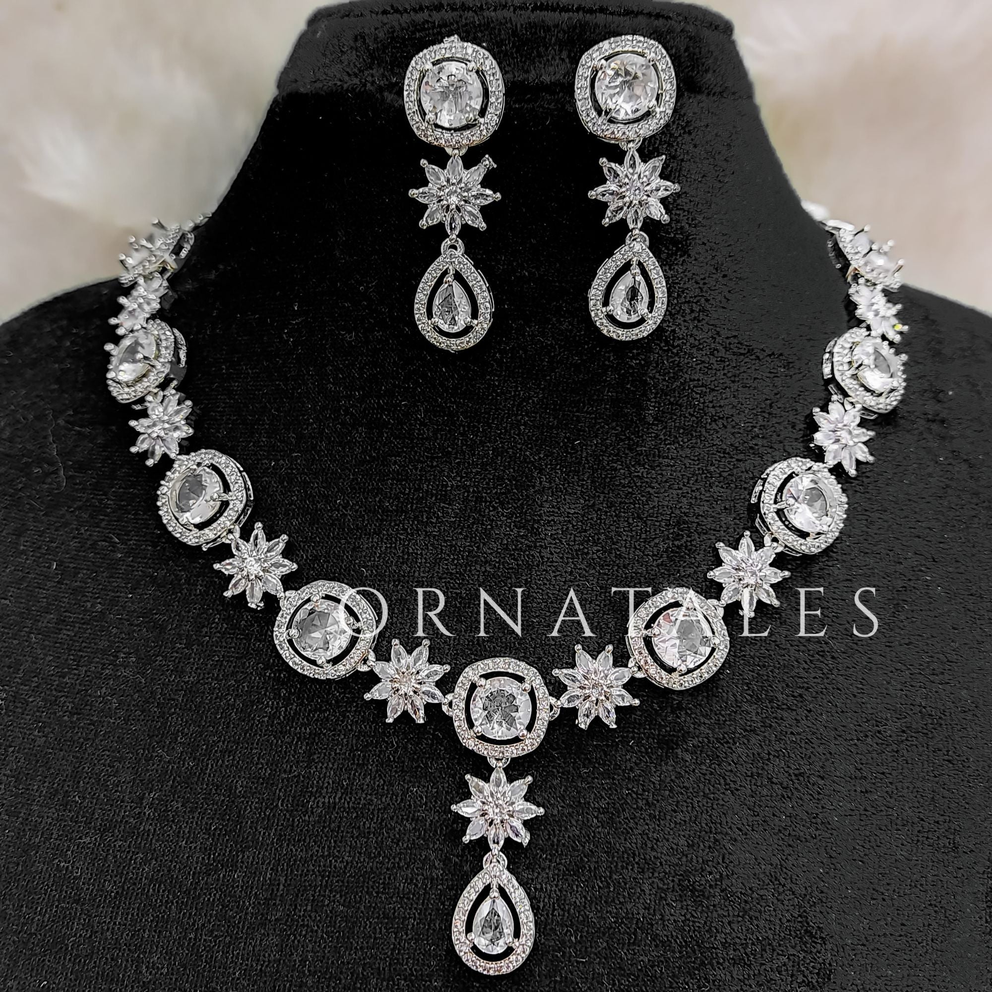 Crystal White Diamond Cut Necklace Set with starburst motif and teardrop design – Ornatales
