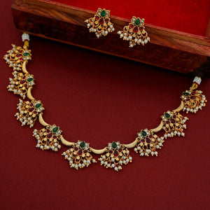 Padmashree Regal lotus-inspired Kundan choker with ruby, emerald, and pearl details, gold base, and delicate pearl fringe edging.