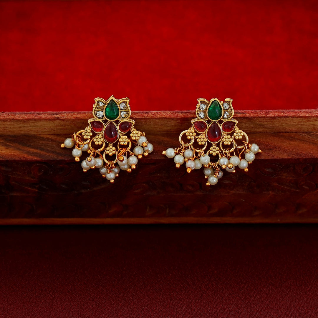 Padmashree Regal lotus-inspired Kundan choker with ruby, emerald, and pearl details, gold base, and delicate pearl fringe edging.