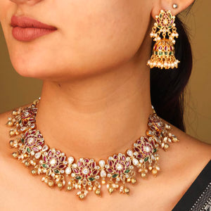 Padmarekha Heritage necklace set with pink-red lotus motif, green and white kundan stones, and golden pearl drops in temple jewellery style.